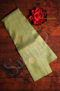 borderless-pastel-green-colour-body-with-orange-thread-small-checked-boxs-small-motifs-and-orange-colour-contrast-blouse