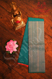 borderless-peacock-blue-colour-body-with-silver-zari-motifs-and-contrast-blouse
