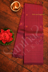 magenta-colour-body-with-copper-zari-strips-peacock-buttas-and-self-colour-blouse