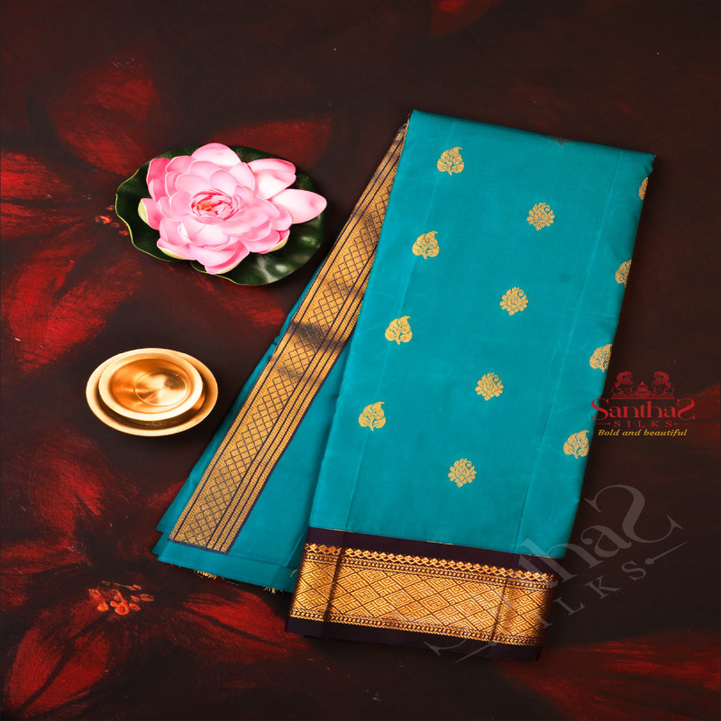 ONESIDE BORDER PEACOCK BLUE COLOUR BODY WITH GOLDEN ZARI BUTTA & WITHOUT BLOUSE