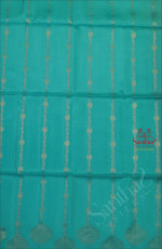 TURQUOISE BLUE COLOUR BODY WITH SILVER ZARI FLORAL BUTTA WITH CONTRAST BLOUSE & BORDER