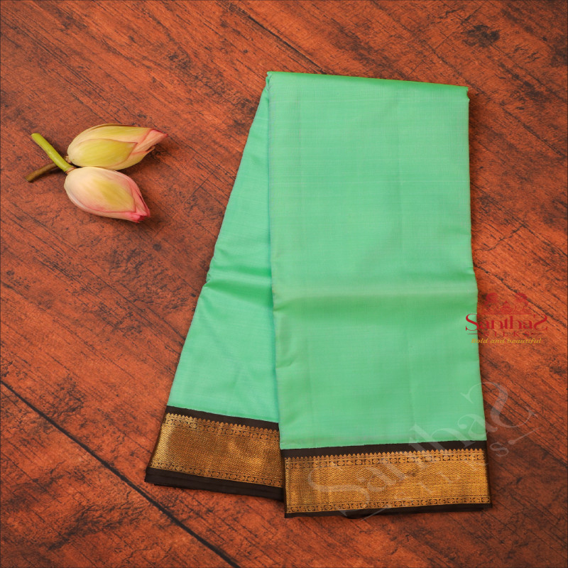 PISTA GREEN COLOUR PLAIN BODY WITH CONTRAST BLOUSE & BORDER