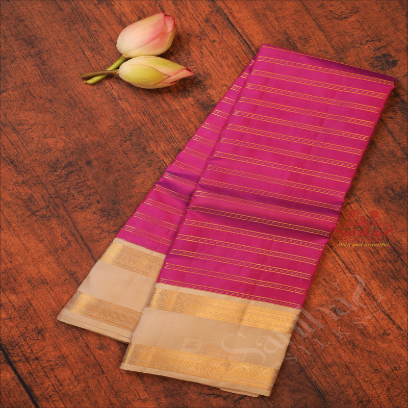 PURPLE COLOUR BODY WITH GOLDEN STRIPS WITH CONTRAST BLOUSE & BORDER