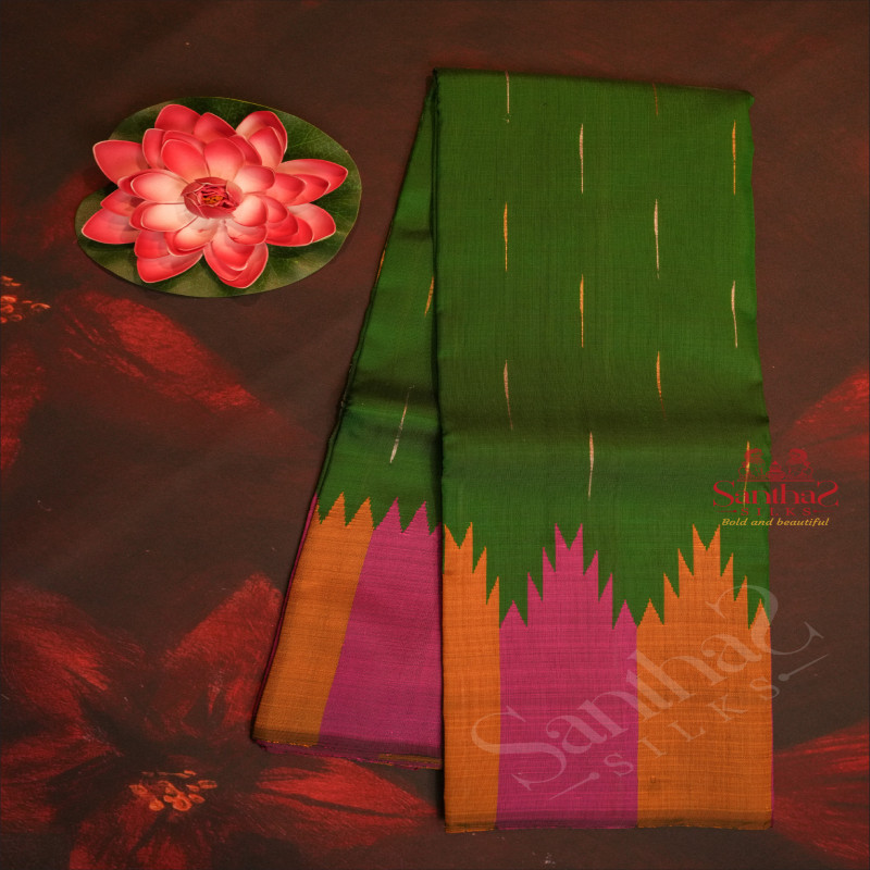 BORDERLESS BOTTLE GREEN COLOUR BODY WITH THALAMBOO MOTIF WITH CONTRAST BLOUSE