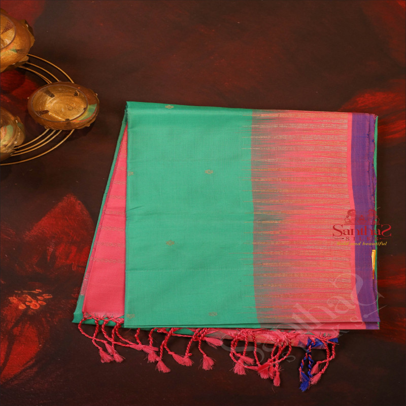 MINT GREEN COLOUR BODY WITH SILVER ZARI STRIPS AND BUTTA WITH CONTRAST BLOUSE & BORDER