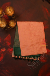 pastel-peach-colour-body-with-fancy-butta-with-contrast-blouse-border