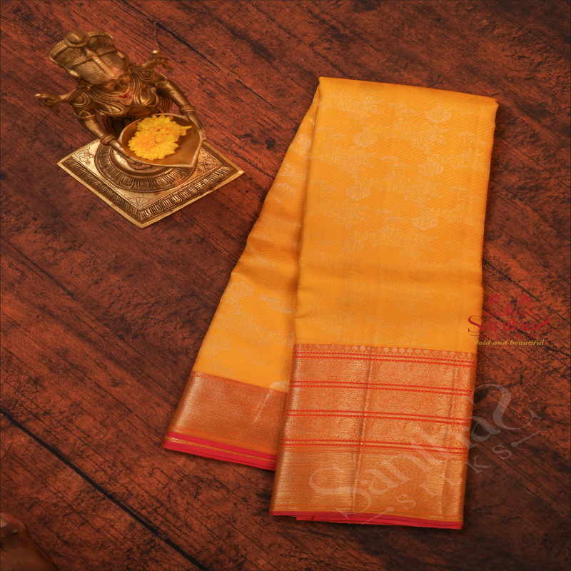 LEMON YELLOW COLOUR BODY WITH JACQUARD EMBOSED PATTERN WITH CONTRAST BLOUSE & PALLU