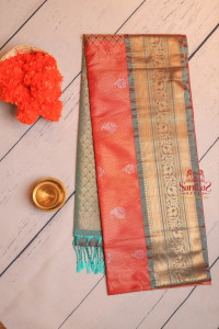 orange-colour-body-with-embosed-mango-zari-butta-with-contrast-blouse-border