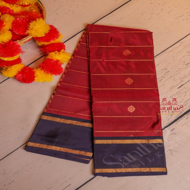 DARK PINK COLOUR BODY WITH GOLDEN STRIPS AND BUTTA WITH CONTRAST BLOUSE & BORDER