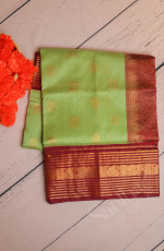 PISTHA GREEN COLOUR BODY WITH GOLDEN ZARI CHAKKARAM BUTTA WITH CONTRAST BLOUSE & BORDER