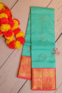 turquoise-blue-colour-body-with-fgolden-zari-butta-with-contrast-blouse-border