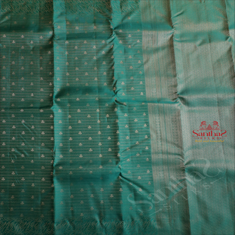 BORDERLESS DARK TEAL BLUE COLOUR BODY WITH ZARI EMBOSED WITH SELF BLOUSE