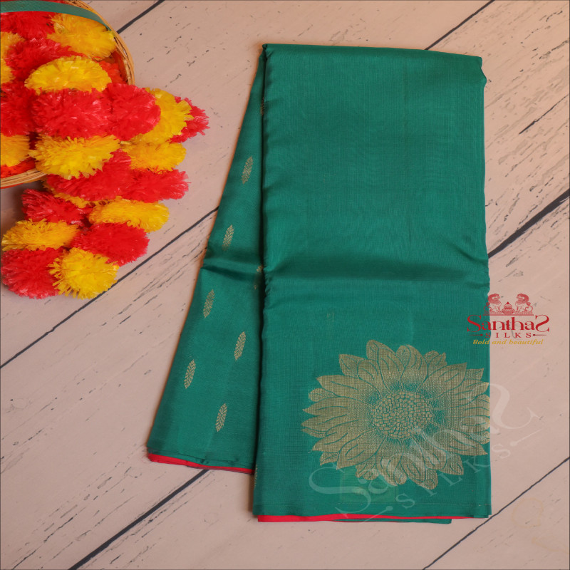 BORDERLESS GREEN COLOUR BODY WITH GOLDEN ZARI BIG FLORAL BUTTA WITH CONTRAST BLOUSE