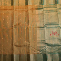 METALIC COPPER COLOUR BODY WITH STRIPS & BUTTAS AND CONTRAST PALLU & BLOUSE