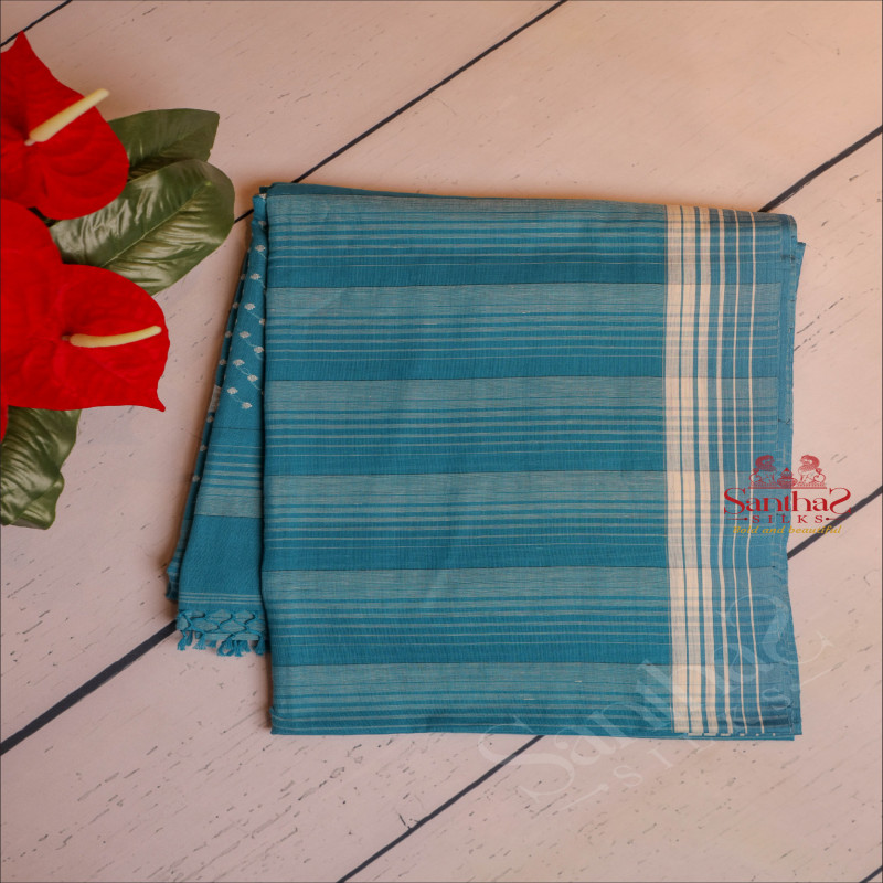 INTEL BLUE COLOUR COTTON SAREE BODY WITH STRIPS AND SELF COLOUR PALLU WITH WHITE THREAD BUTTAS & BLOUSE