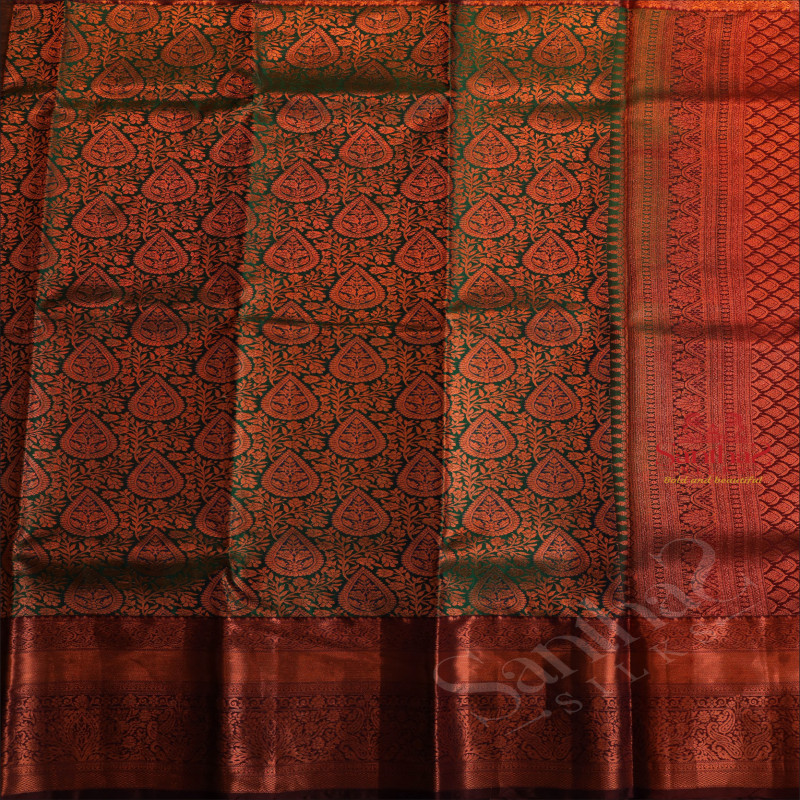 GREEN COLOUR BODY WITH JACQUARD FLORAL EMBOSED WITH CONTRAST MAROON BLOUSE & BORDER