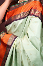 PASTEL GREEN KANJIVARAM SILK SAREE WITH RICH ORANGE BORDER