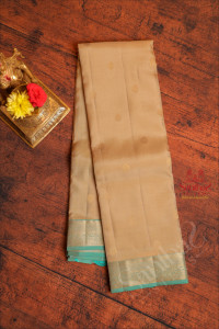 brushed-gold-colour-body-with-golden-zari-buttas-and-contrast-pallu-blouse