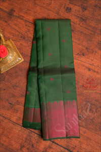 dark-green-colour-body-with-rani-pink-colour-zari-buttas-and-self-colour-pallu-blouse