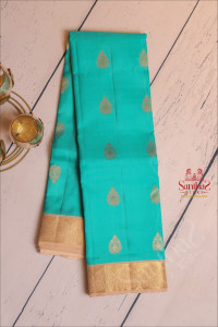 aqua-marine-blue-colour-body-with-golden-zari-buttas-and-contrast-pallu-blouse