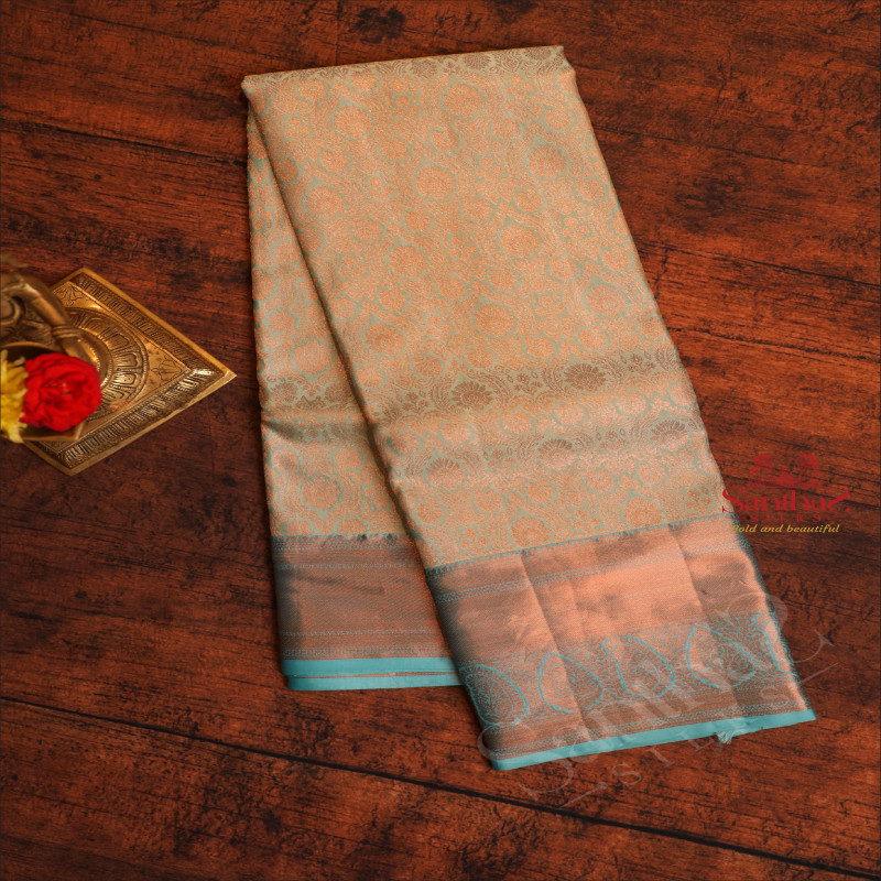 ICE BLUE COLOUR BODY WITH JACQUARD FLORAL EMBOSED WITH COPPER ZARI BORDER AND CONTRAST BLOUSE