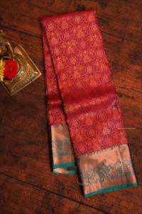 maroon-colour-body-with-jacquard-floral-embosed-with-contrast-green-blouse-pallu