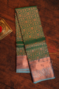 dark-green-colour-body-with-jacquard-floral-embosed-in-copper-zari-with-contrast-blouse-blue-border