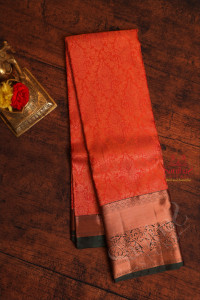 dark-red-colour-body-with-jacquard-floral-embosed-in-copper-zari-with-contrast-blouse-border