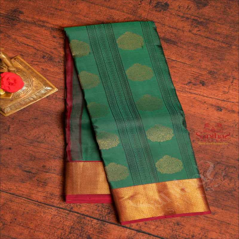 FOREST GREEN COLOUR BODY WITH GOLDEN ZARI MOTIFS & EMBOSED DESIGN AND CONTRAST PALLU & BLOUSE
