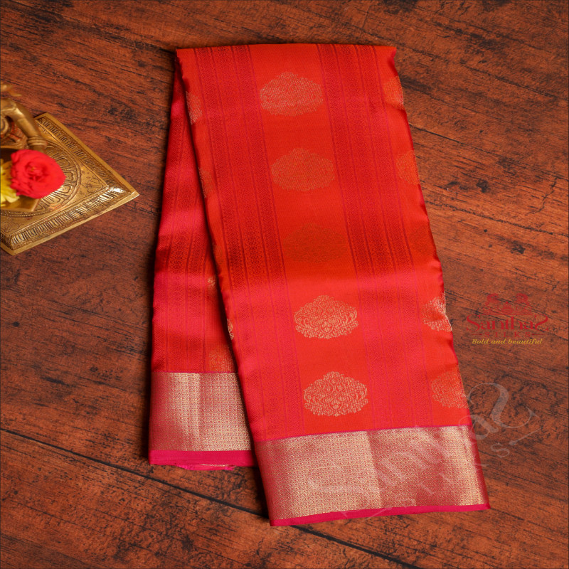 ORANGE COLOUR BODY WITH GOLDEN ZARI BUTTA & EMBOSED DESIGN AND CONTRAST PALLU & BLOUSE