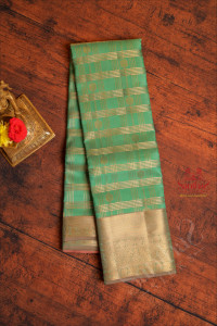 cool-green-colour-body-with-golden-zari-strips-buttas-and-contrast-pallu-blouse