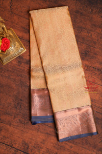 sandal-colour-body-with-jacquard-floral-embosed-in-copper-zari-with-contrast-blouse-border