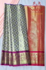 GREENISH GOLD TISSUE PATTUPAVADAI WITH CONTRAST BORDER AND BLOUSE