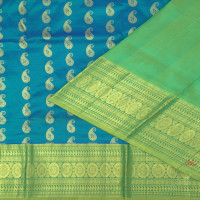 PEACOCK BLUE BODY IN ZARI MANGO BUTTA WITH CONTRAST BLOUSE & BORDER